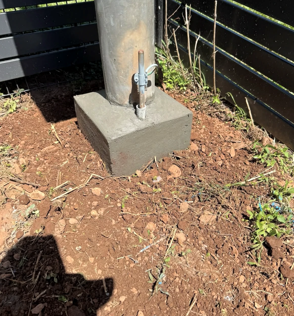 Property pole at a residential boundary, shown during a repair